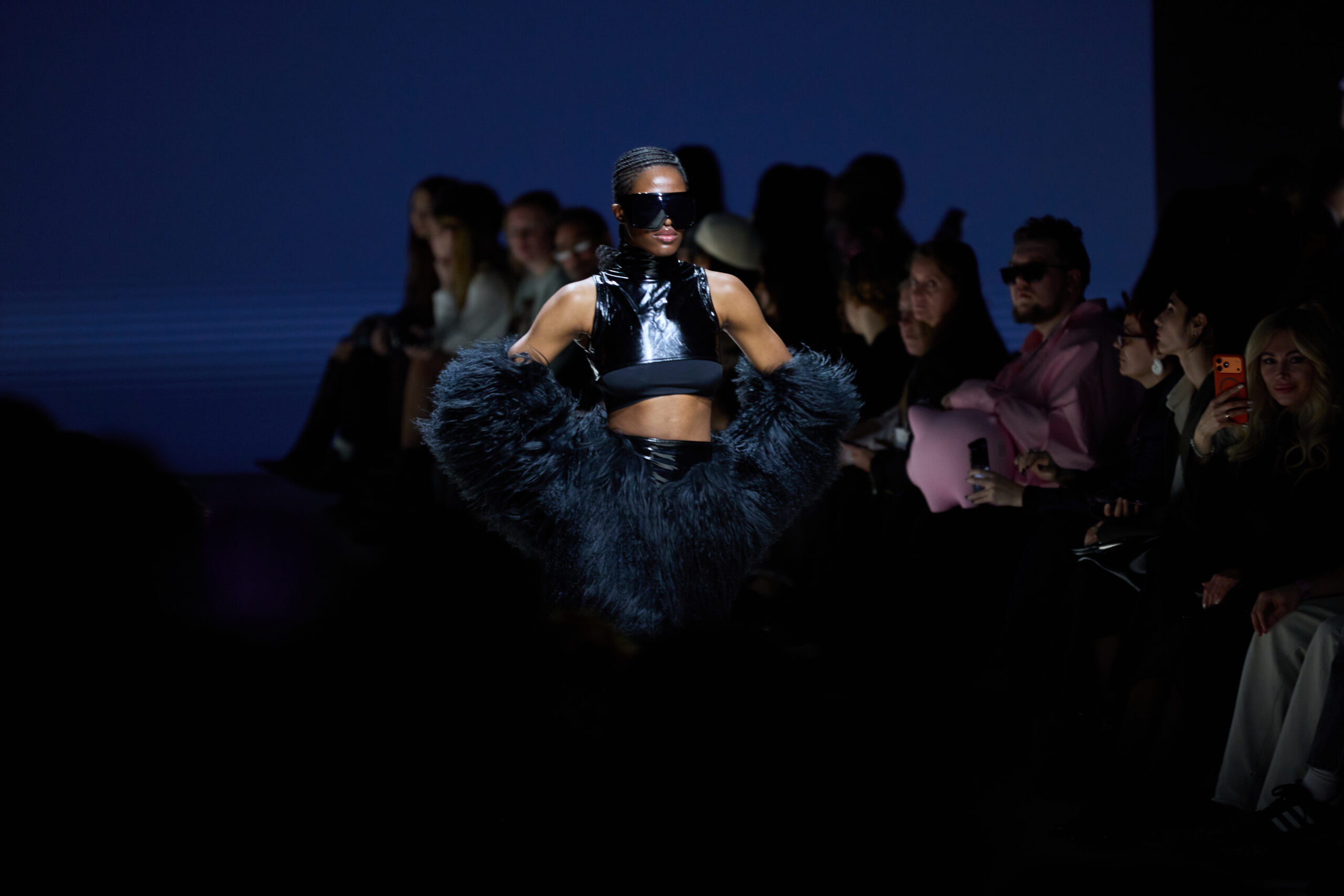 A woman walks down the runway