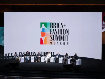 people sitting on the stage at a conference