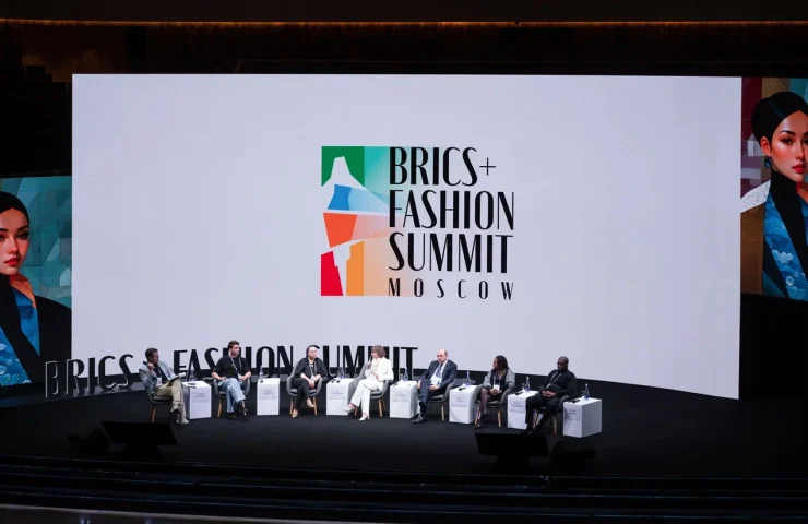 people sitting on the stage at a conference